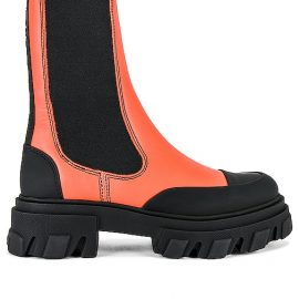 Ganni Cleated Mid Chelsea Boot in Orange. Size 36, 37, 38, 39.